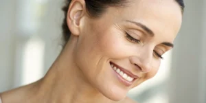 A smiling woman showing the natural-looking results of botox for dynamic wrinkles.