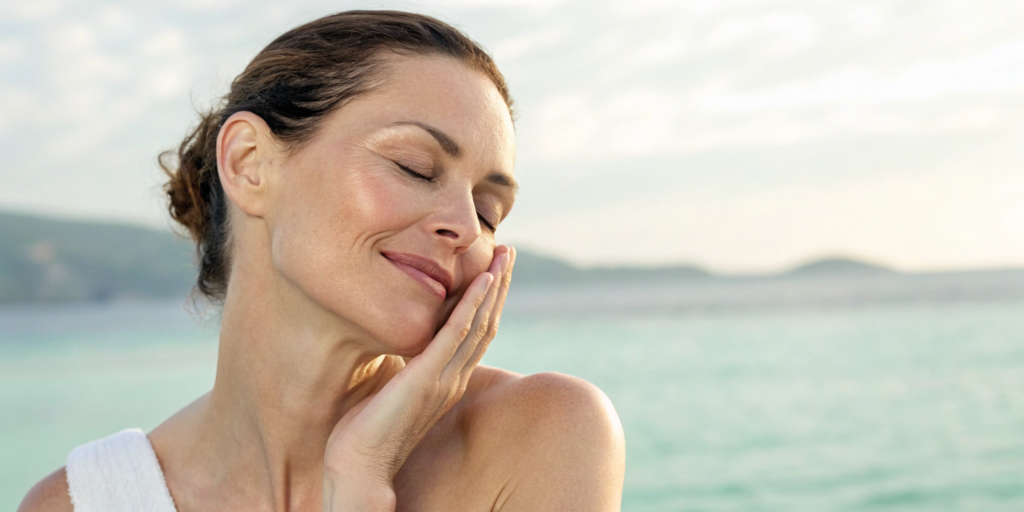 A woman in her 40s with smooth skin, a result of getting Botox on a regular schedule.