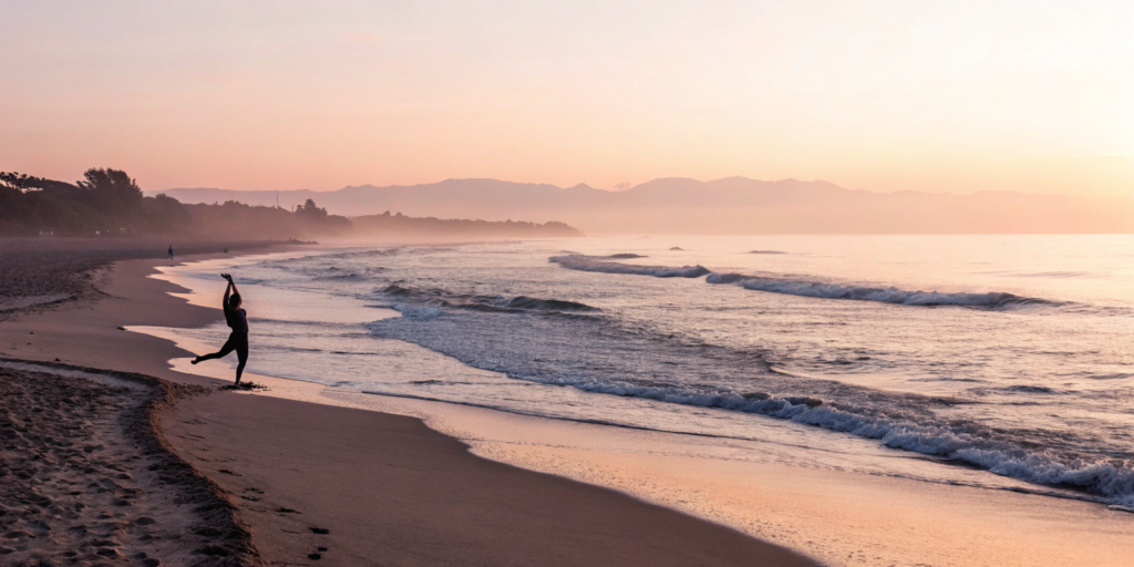 A person stretching on a beach to find relief from tight abs.